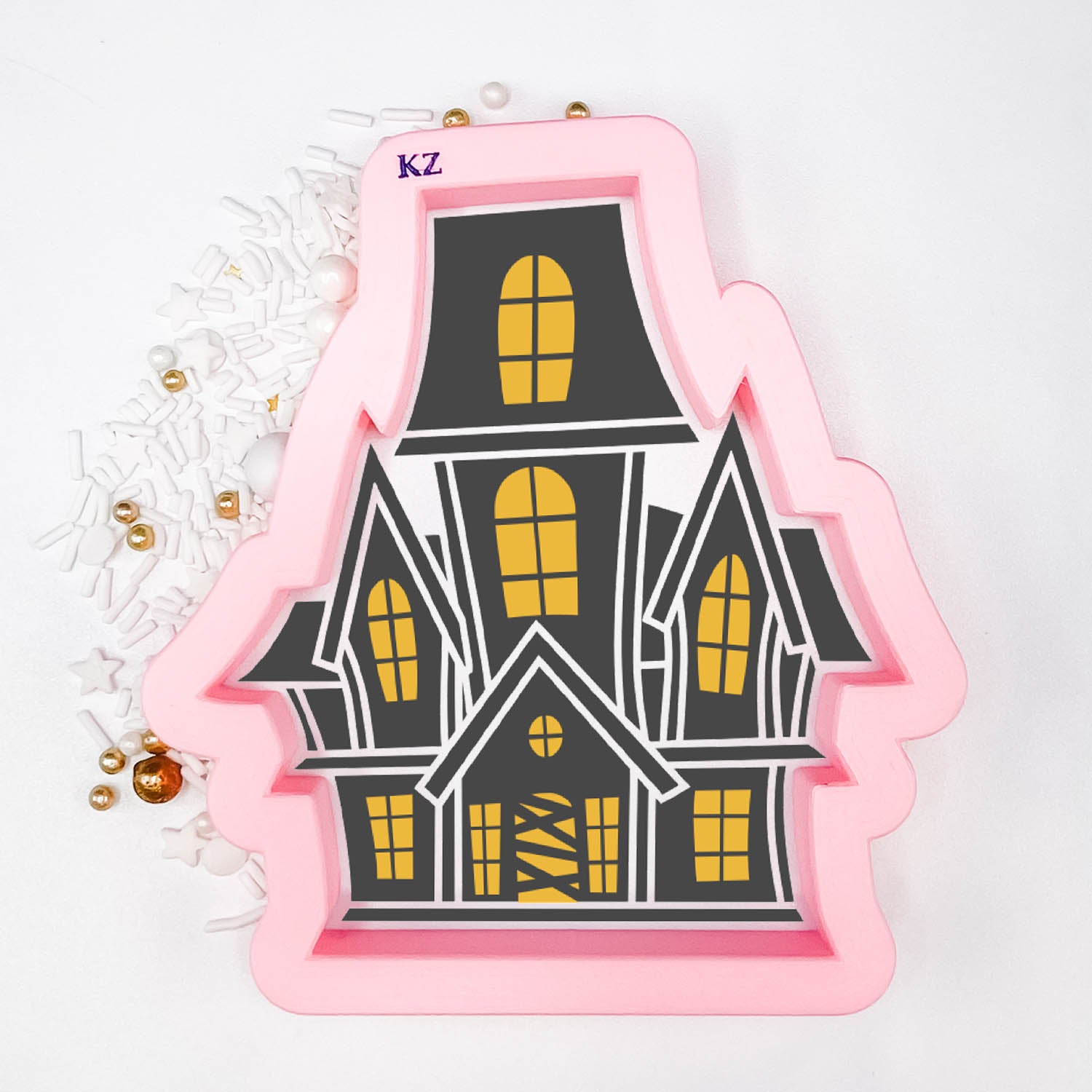cookie cutter in the shape of a haunted house