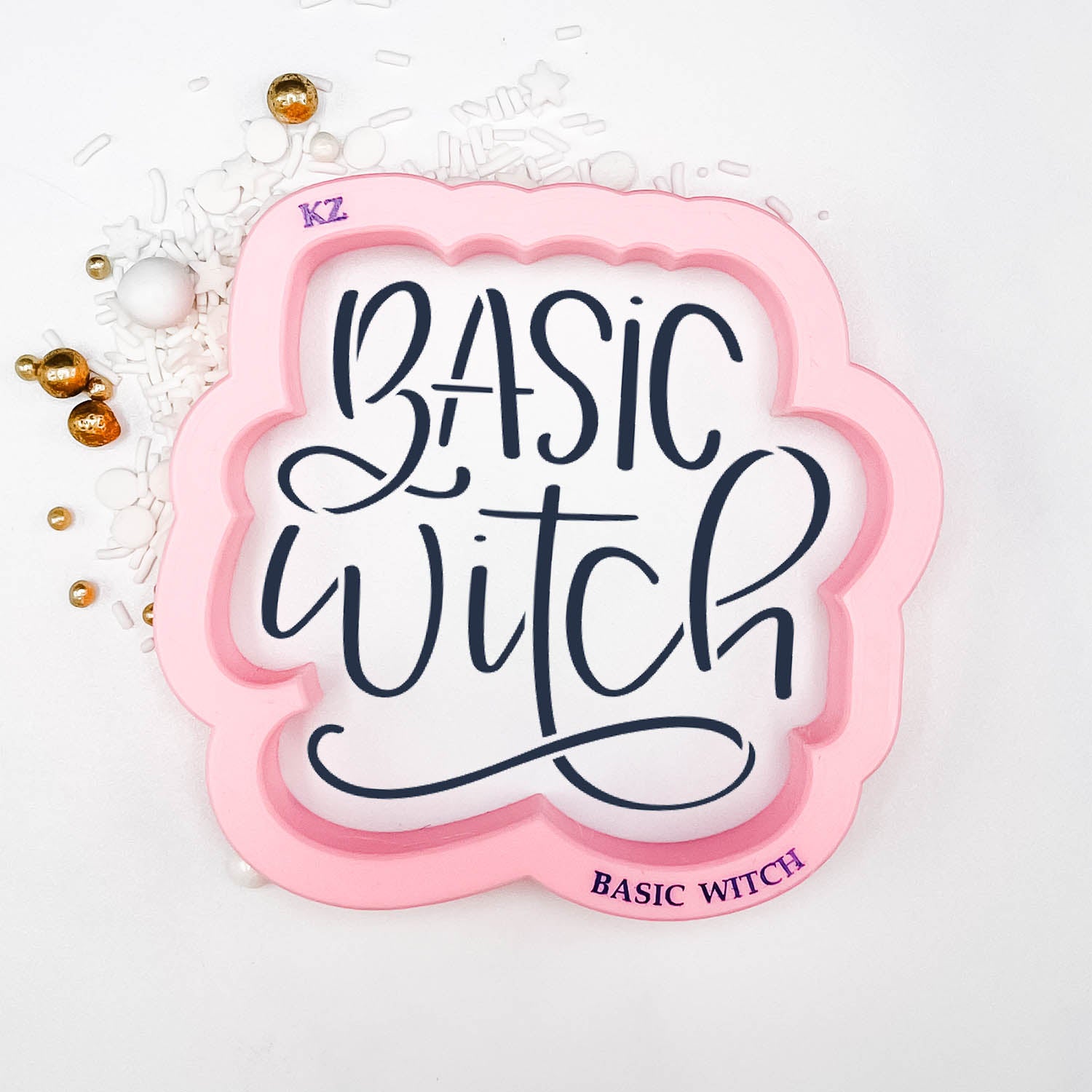 cookie cutter in the shape of the words "basic witch"