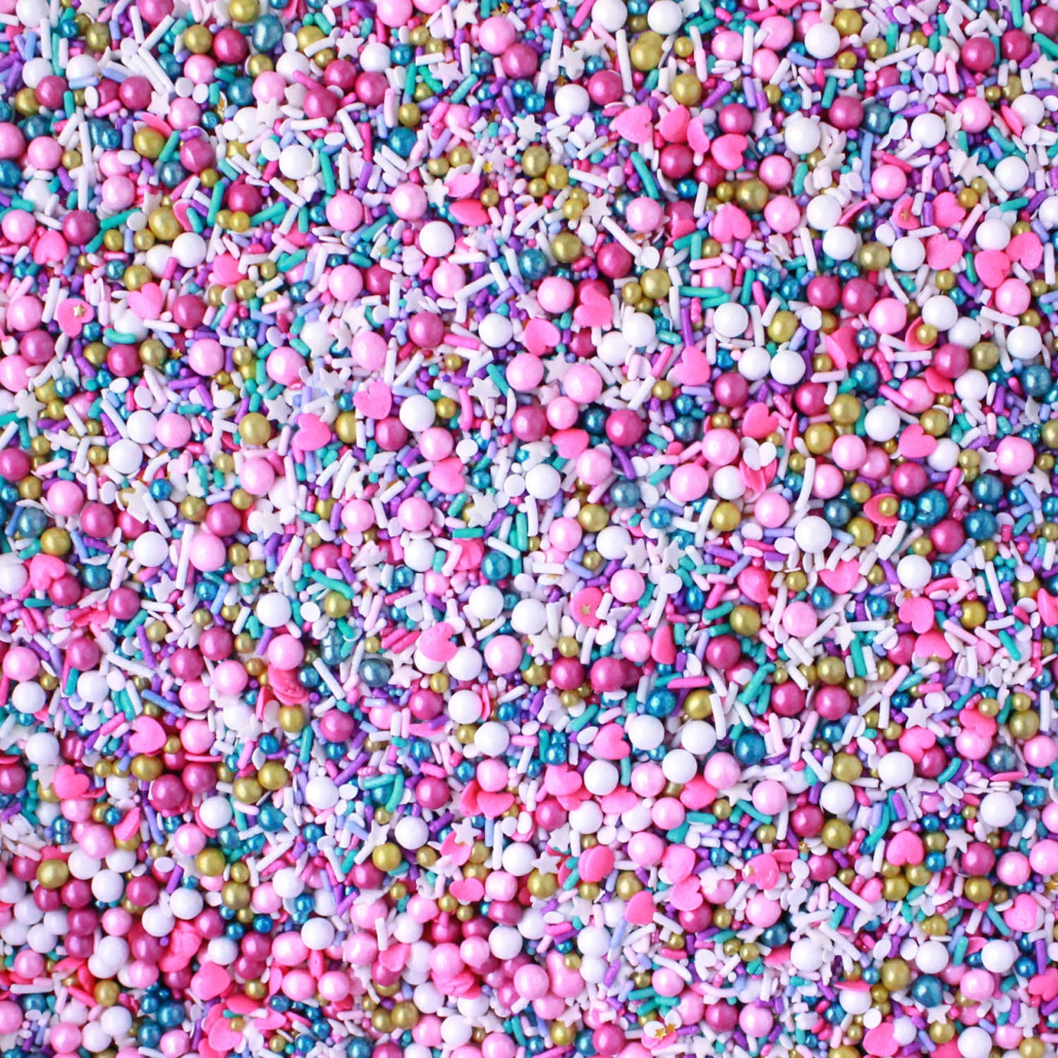 Sprinkle mix with light and dark pink, gold, blue, and white spheres and rods. Same colors as smaller sprinkle pieces.